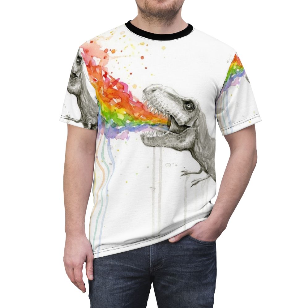 Whimsical illustration of a T-Rex dinosaur vomiting a rainbow of colors on a colorful t-shirt. - men front