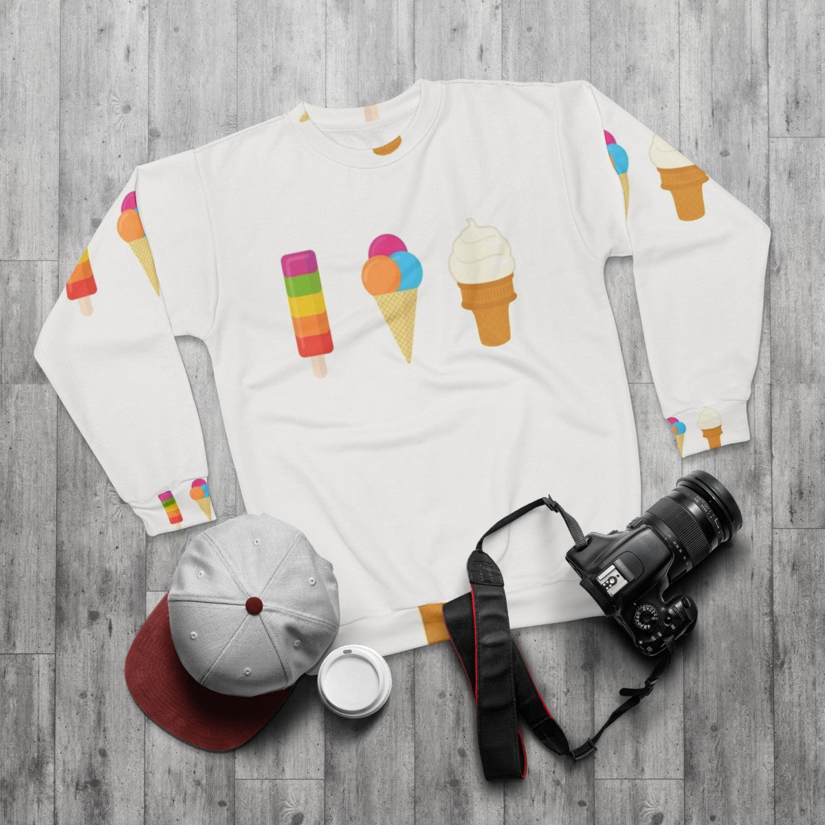 Colorful ice cream sweatshirt with popsicle, cone, and lolly pop graphics - flat lay