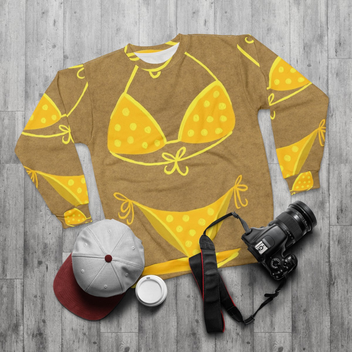 Yellow polka dot sweatshirt with vintage-inspired design - flat lay