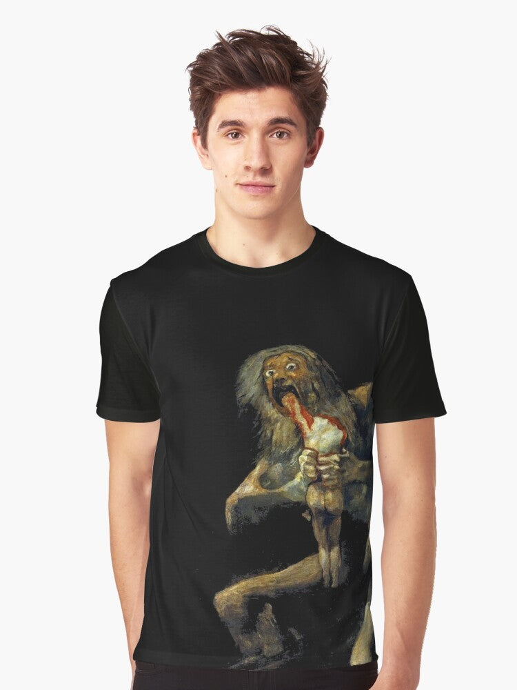 A graphic t-shirt featuring the renowned painting "Saturn Devouring His Son" by the Spanish artist Francisco Goya. - Men