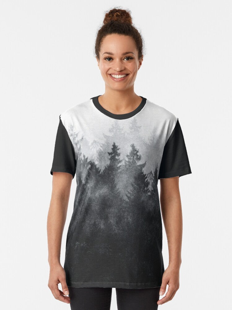 Vintage landscape graphic t-shirt featuring a nature scene with trees, fog, and mountains - Women