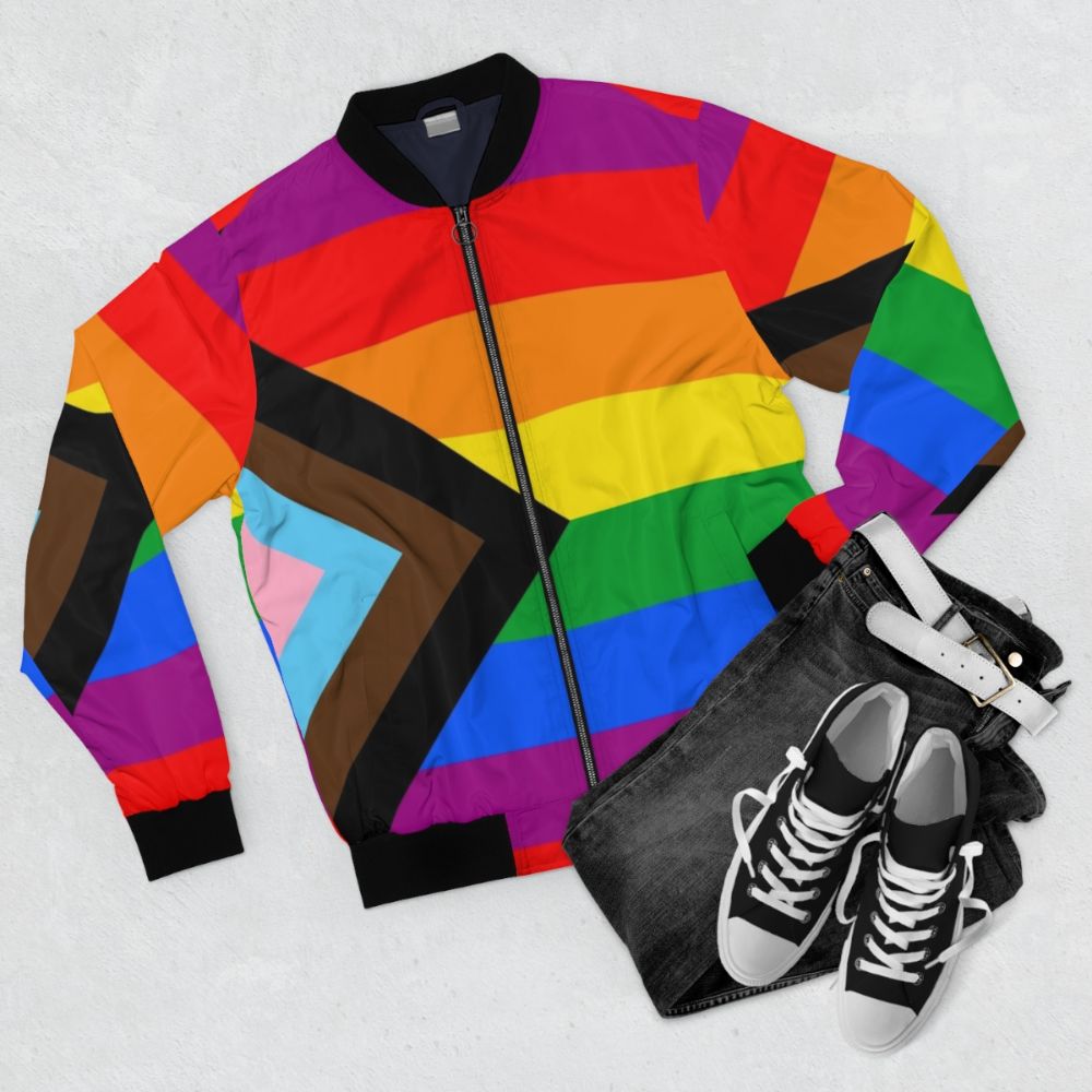 LGBTQ+ Progress Pride Flag Bomber Jacket - Celebrate Pride with this stylish and inclusive bomber jacket featuring the Progress Pride Flag design. - Flat lay