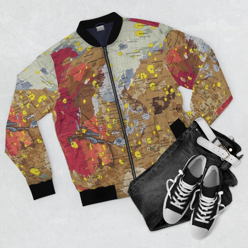 Bomber jacket featuring a detailed infographic design of the geology and landscape of the planet Mars - Flat lay