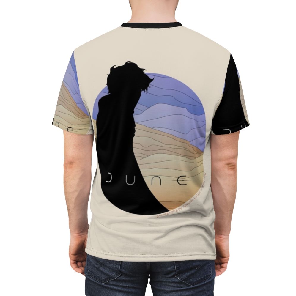 Stylized illustration of Paul Atreides, the central character from the Dune science fiction series, featured on a high-quality t-shirt. - men back