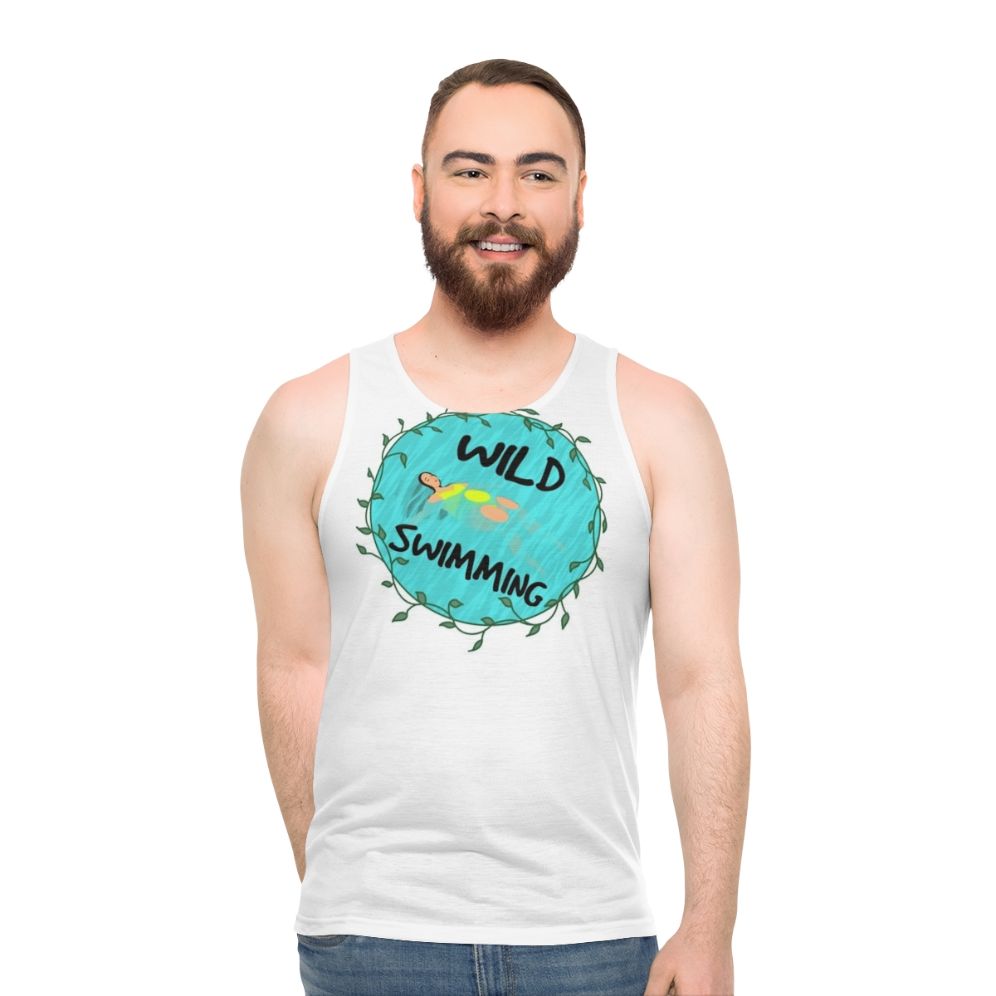 Model wearing the Wild Swimming Unisex Tank Top in a natural outdoor setting - men