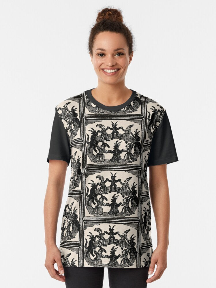 Vintage-style graphic t-shirt featuring a witches' circle dance design in a gothic, medieval style. - Women