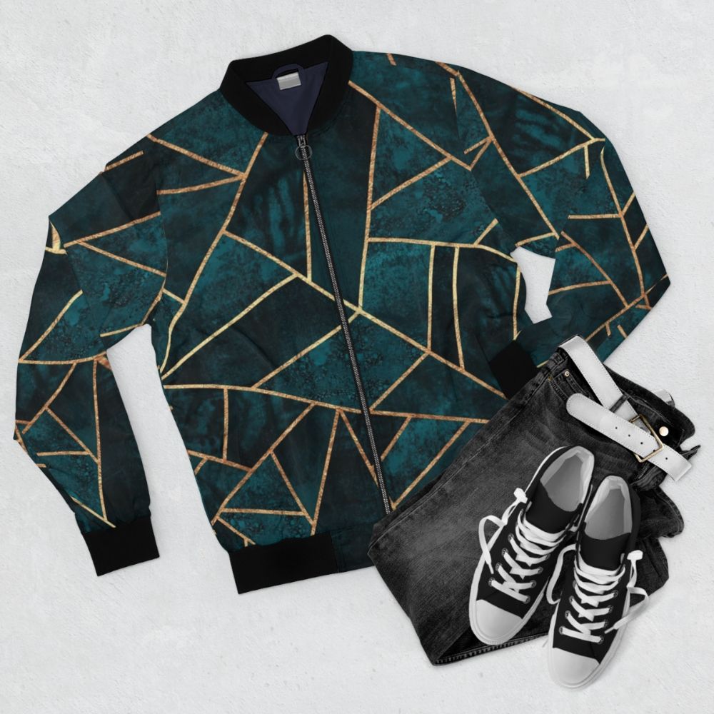 Geometric dark teal bomber jacket with abstract pattern - Flat lay