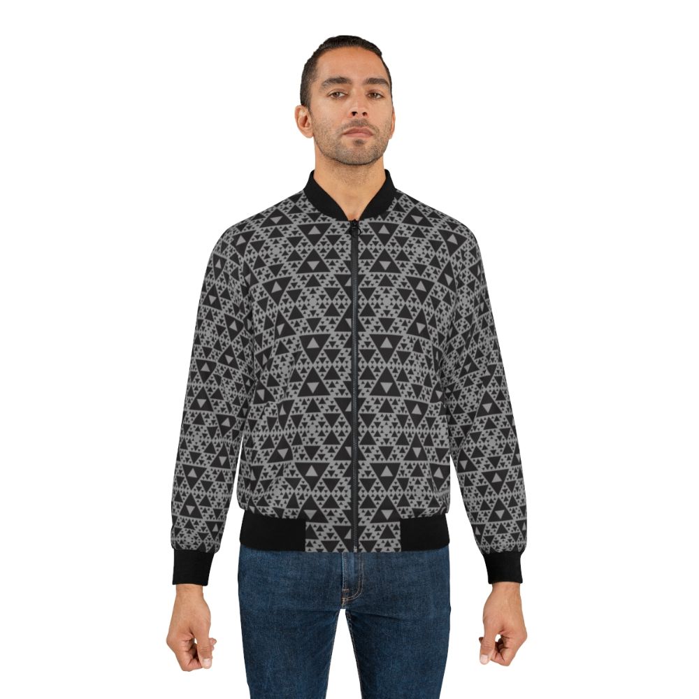 Dark-colored bomber jacket with a repeating triangle pattern, inspired by motion capture technology and Sierpinski triangles. - Lifestyle