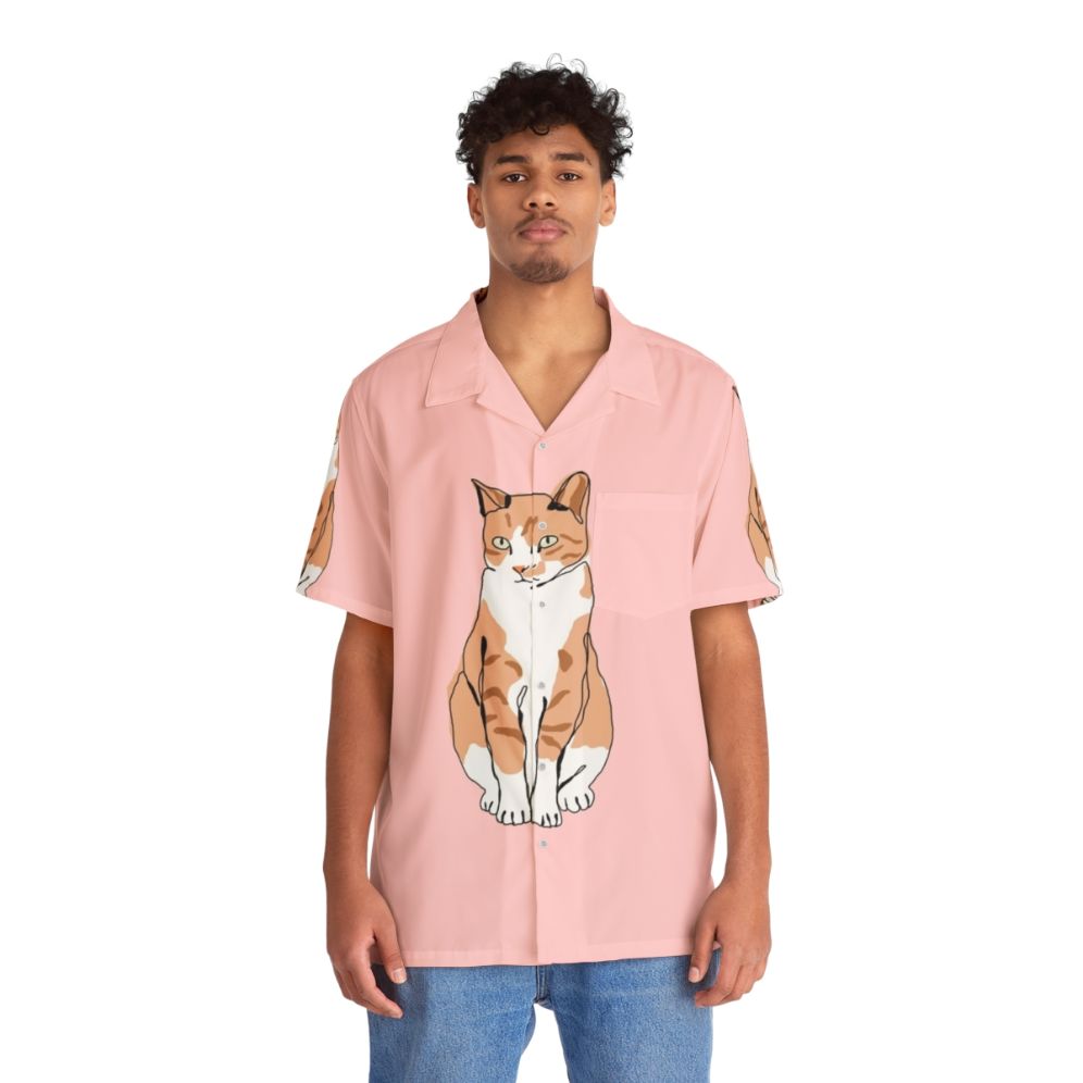 Cat wearing a colorful Hawaiian-style tropical print shirt - People Front