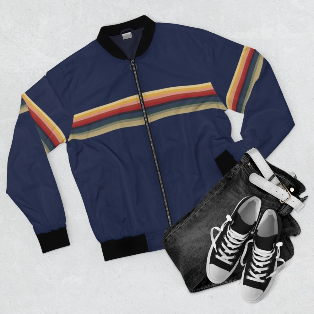 Thirteenth Doctor Bomber Jacket with rainbow lines pattern, featuring Jodie Whittaker's 13th Doctor from the sci-fi TV series. - Flat lay