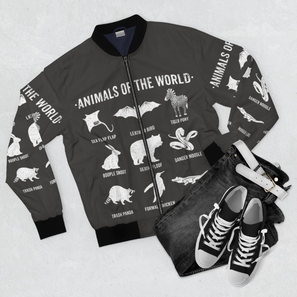 Vintage bomber jacket featuring designs of funny and rare animals from around the world, including bats, bears, crocodiles, and more. - Flat lay