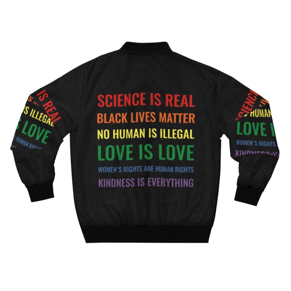 Bomber jacket with text "Science is real! Black lives matter! No human is illegal! Love is love! Women's rights are human rights! Kindness is everything!" - Back