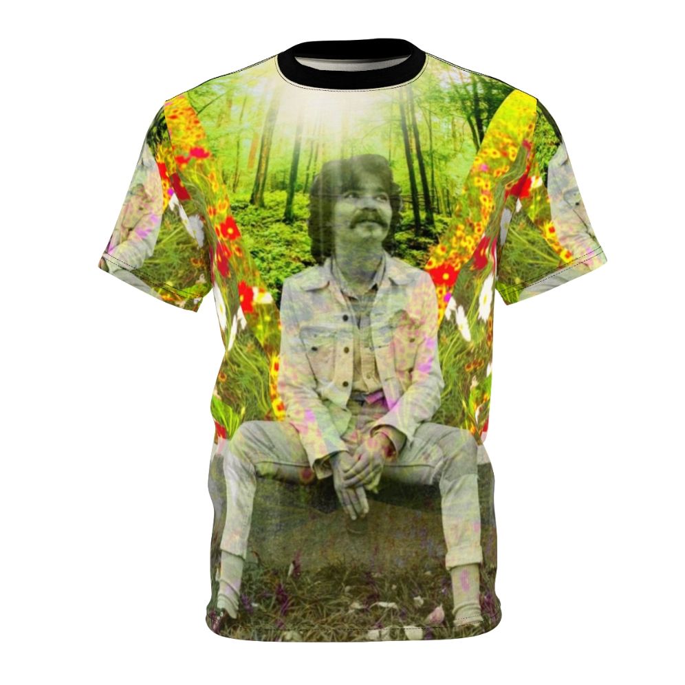 A black and white t-shirt design featuring colorful flowers and text honoring the late folk music legend John Prine.