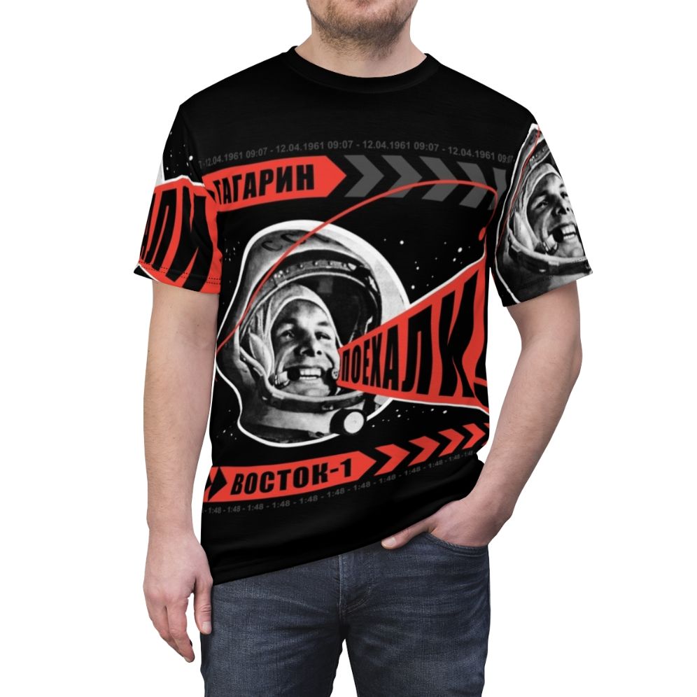 Retro-style t-shirt featuring the iconic "Poyekhali" space art design by Alexander Rodchenko, celebrating the Soviet space program and Yuri Gagarin's historic flight. - men front