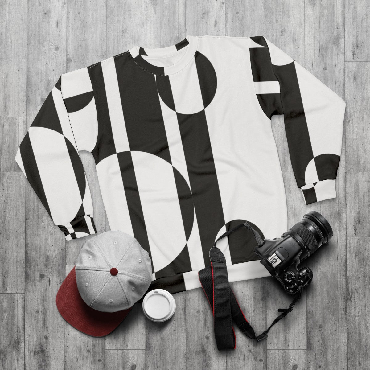 Retro 1960s black and white op art sweatshirt - flat lay