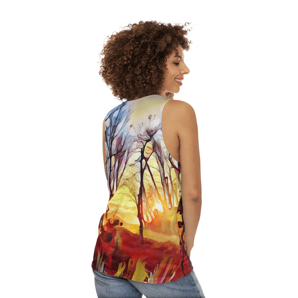 Unisex tank top with a serene mountain landscape and sunrise over trees design - women back