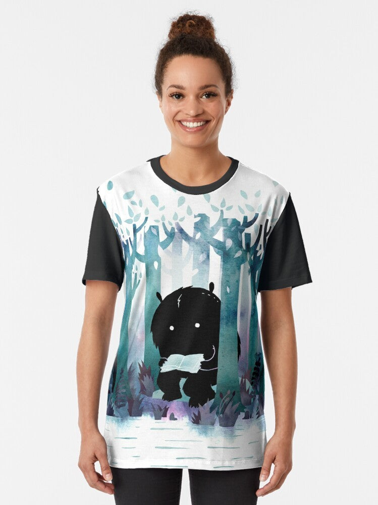 Whimsical "A Quiet Spot" graphic t-shirt featuring a watercolor monster reading books in a forest setting - Women