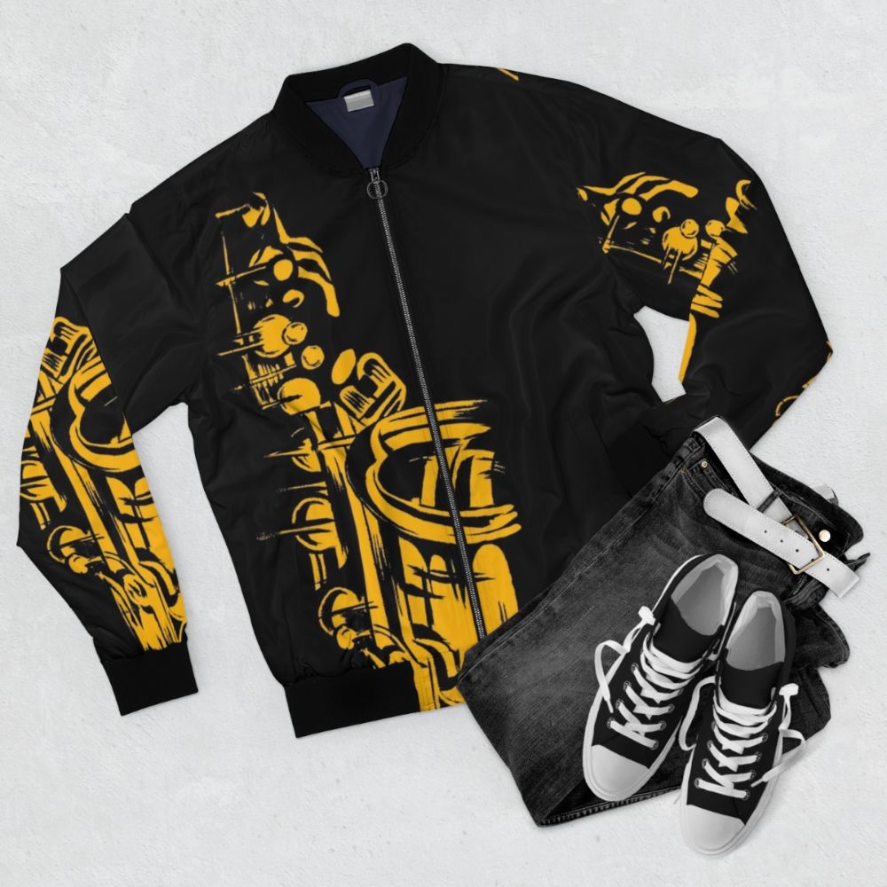 Stylish saxophone-themed bomber jacket with a metallic silhouette design - Flat lay