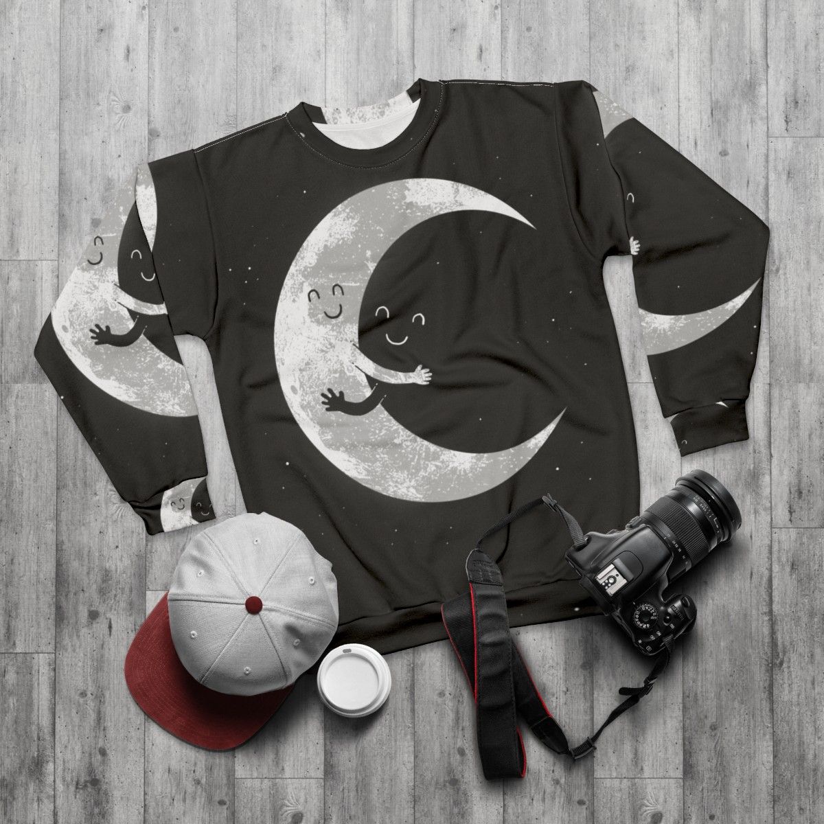 Celestial Moon Hug Sweatshirt with a smiley face moon design - flat lay