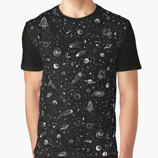 A black and white graphic t-shirt design featuring a cosmic space theme with planets, stars, and a rocket.