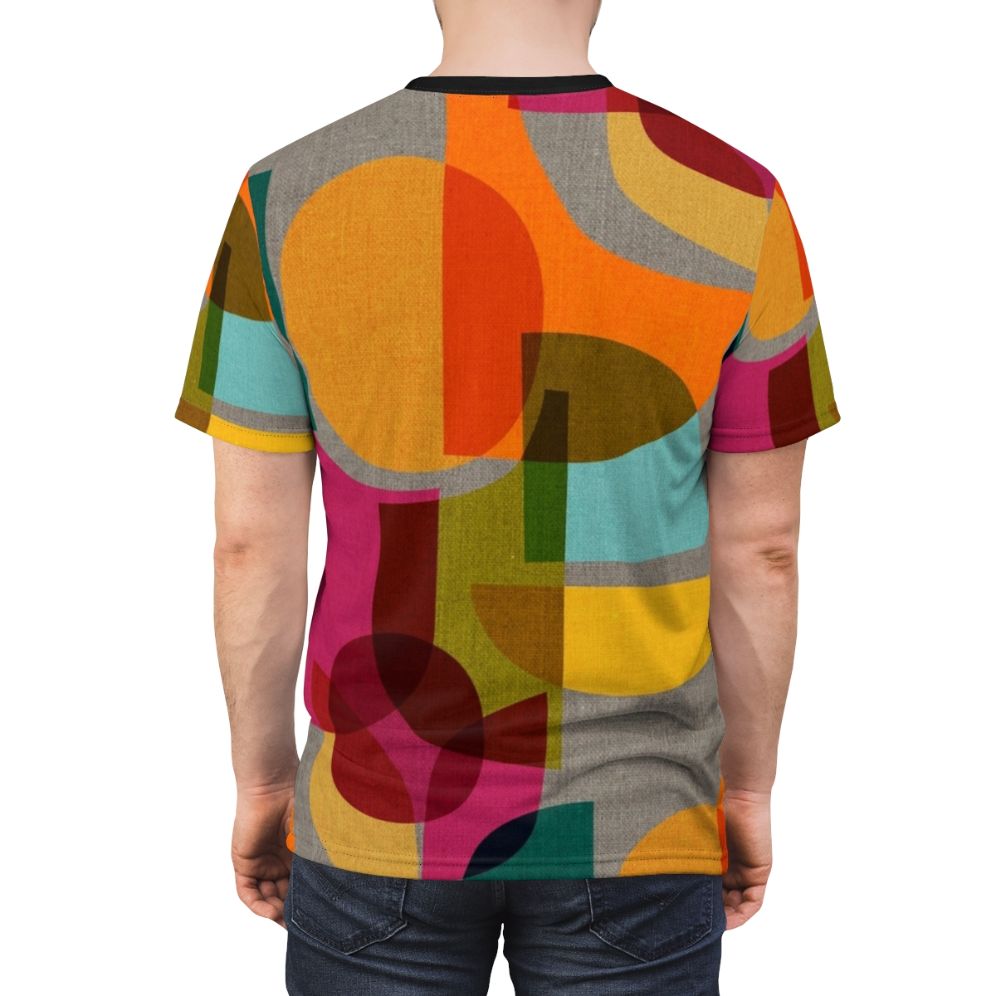 A vibrant mid-century inspired t-shirt featuring a kaleidoscope-like abstract geometric design in a rainbow of colors. - men back