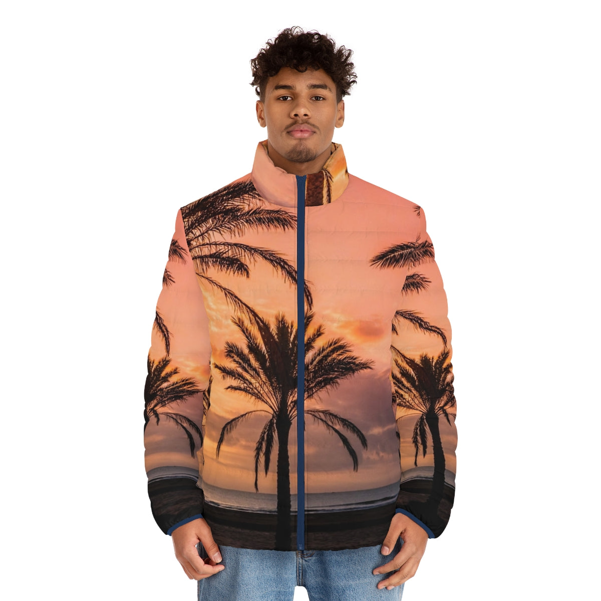 A person wearing a puffer jacket with a scenic view of the sun rising among palm trees on a beach - men front