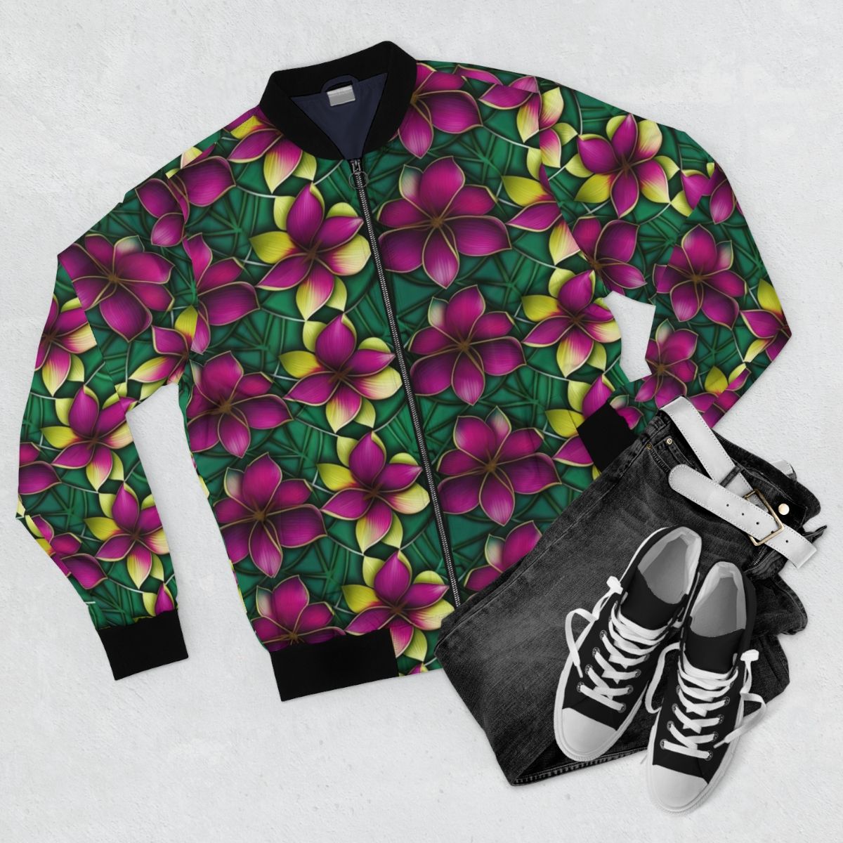 Colorful plumeria flower print on a vibrant bomber jacket - Flat lay