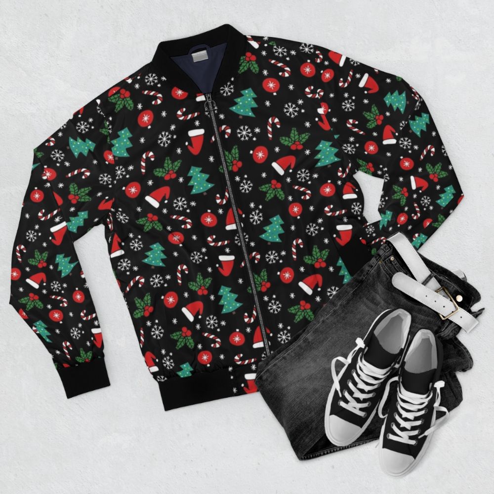 A cozy and stylish Christmas bomber jacket featuring a festive pattern with flowers, music notes, trees, and snowflakes. - Flat lay