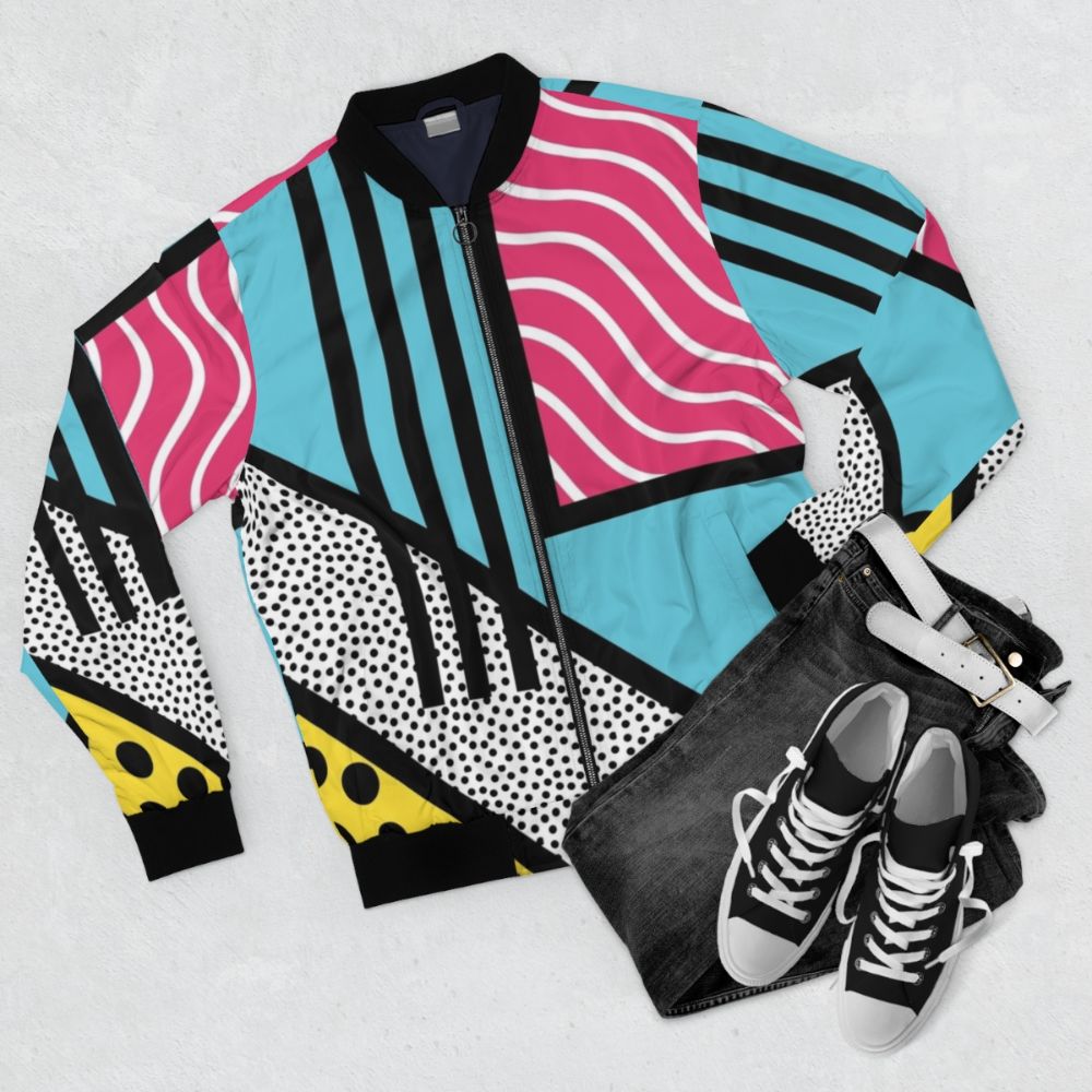 Abstract 80s Memphis pop art style graphics printed on a colorful and trendy bomber jacket. - Flat lay