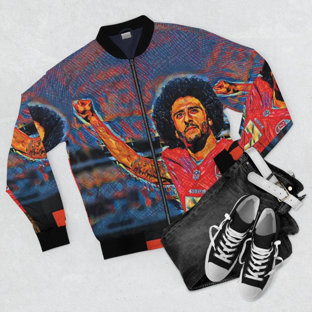 A stylish bomber jacket featuring the image of Colin Kaepernick kneeling during the national anthem - Flat lay