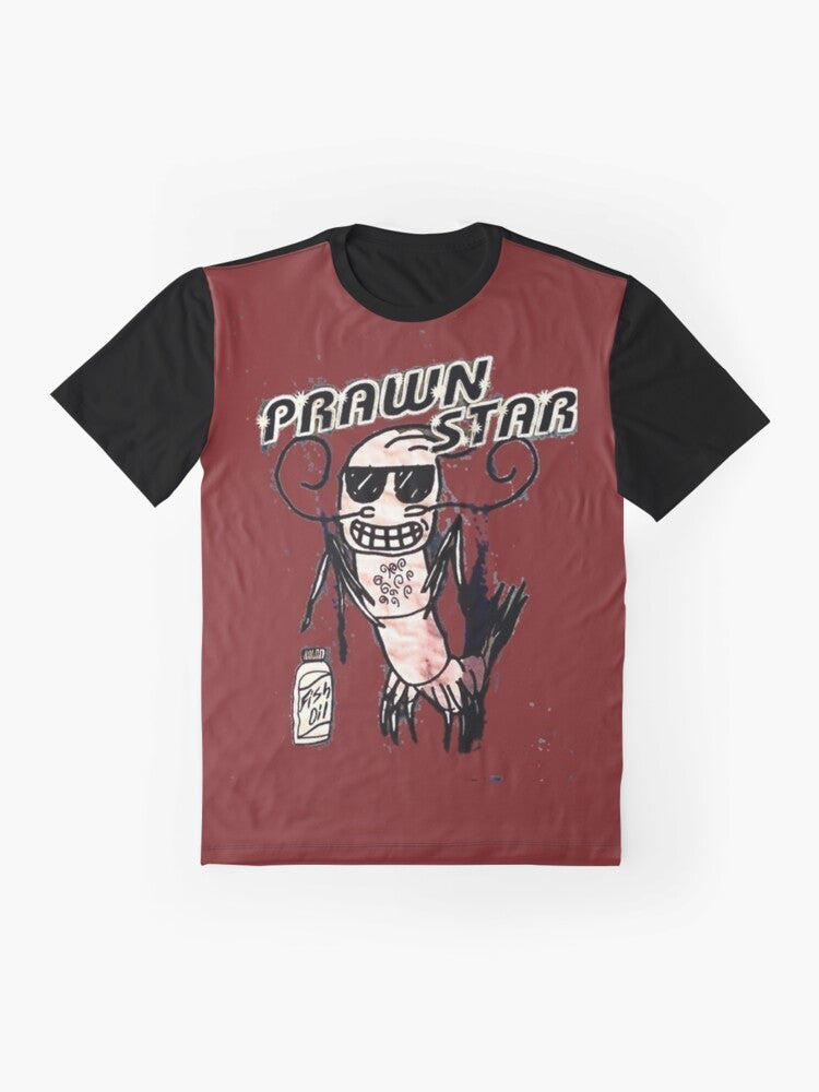 A graphic t-shirt featuring a playful pun design of a "prawn star" character. - Flat lay