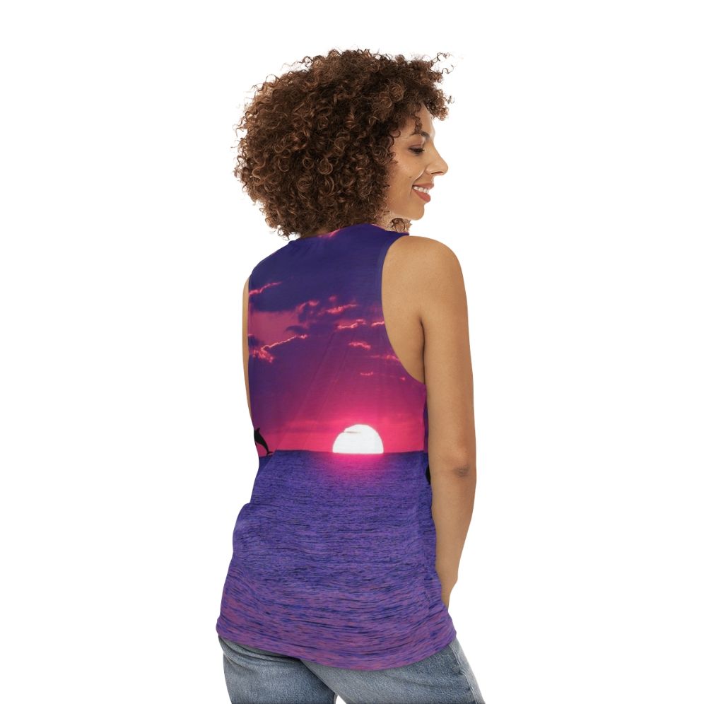 Unisex tank top featuring a breathtaking beach sunset in pink and purple sky - women back