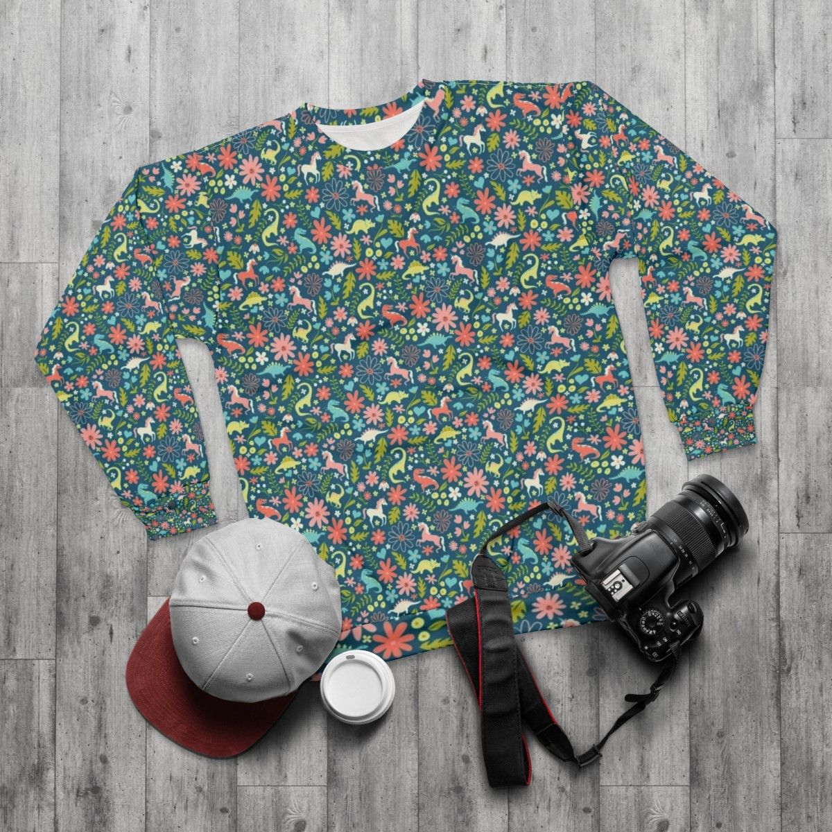 Magical dinosaur and unicorn sweatshirt with floral pattern - flat lay