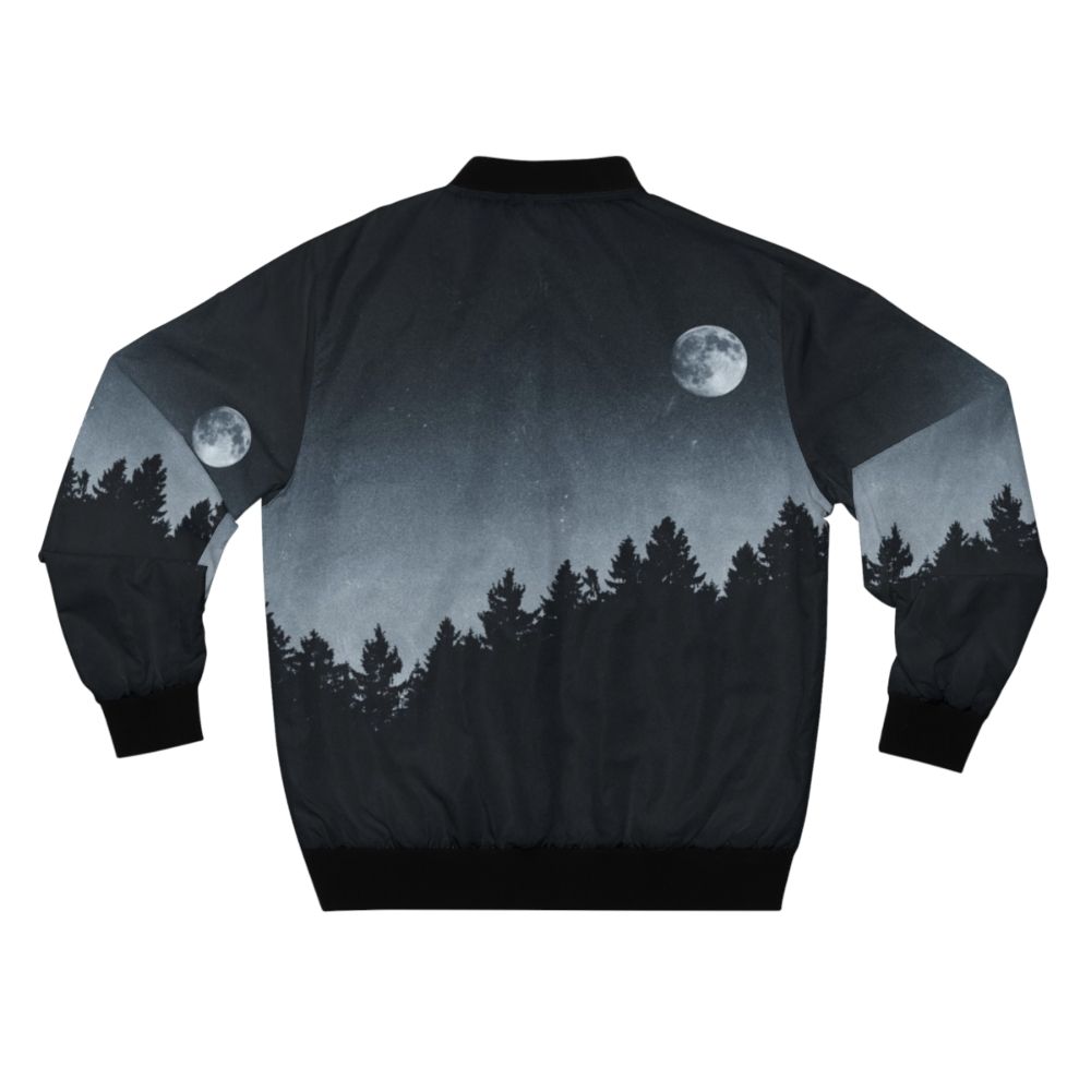 A black bomber jacket with a nature-inspired design, featuring the moon, trees, and a mysterious landscape. - Back