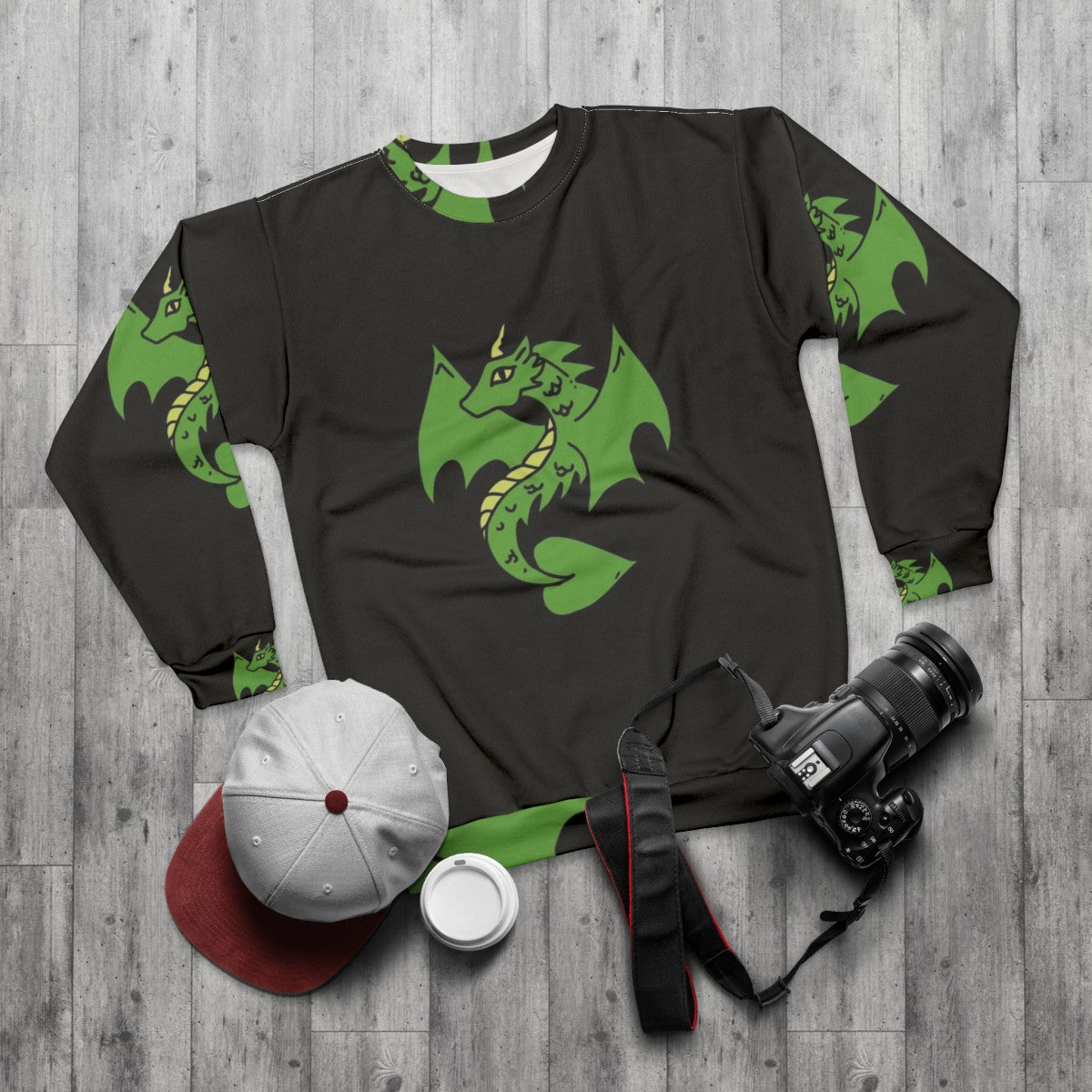 Green dragon design on a cozy sweatshirt for fantasy enthusiasts - flat lay