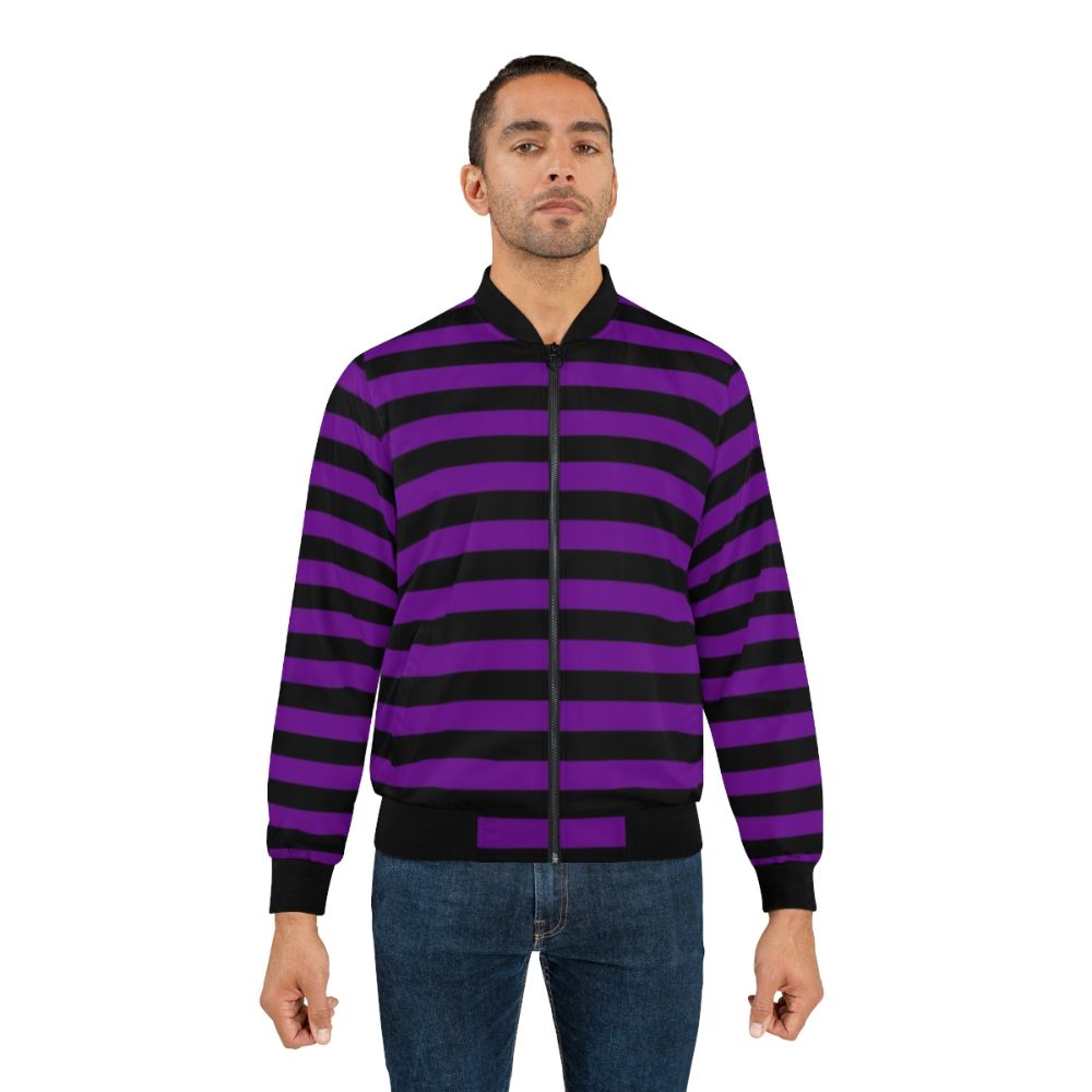 A medium-weight bomber jacket with horizontal violet and black stripes. - Lifestyle