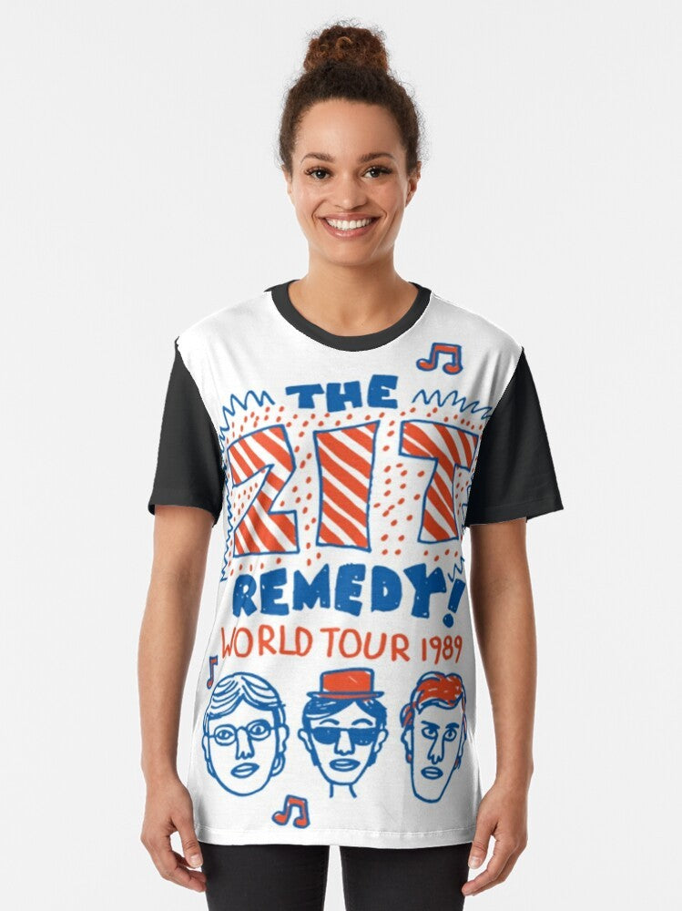 "Degrassi: The Zit Remedy Graphic T-Shirt featuring the iconic Zit Remedy band logo from the classic 90s TV series Degrassi Junior High." - Women