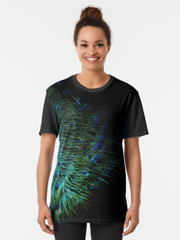 Graphic t-shirt design featuring abstract peacock feathers on a black background, modern aesthetic. - Women