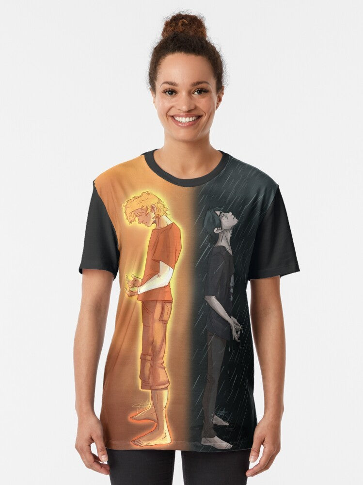 Graphic tee featuring Nico di Angelo and Will Solace from the Percy Jackson universe, with a sun and rain design. - Women