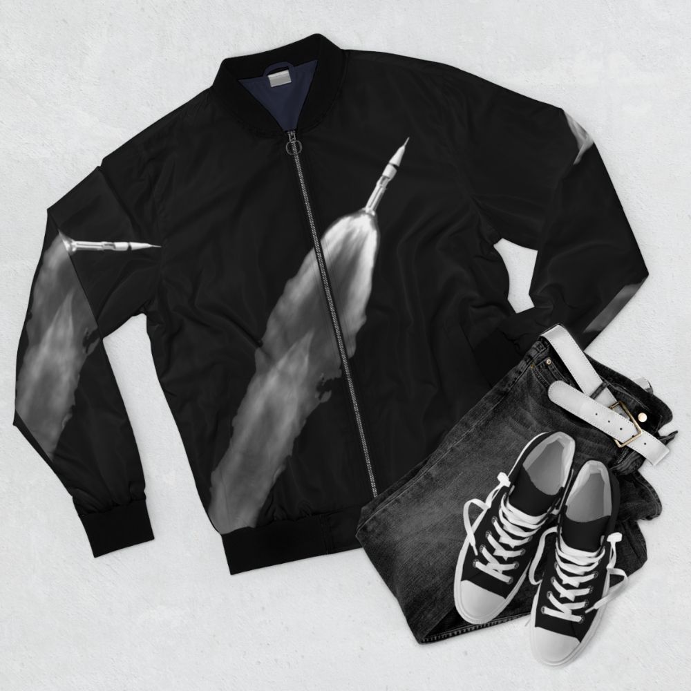 Space exploration bomber jacket with rocket and planet graphics - Flat lay