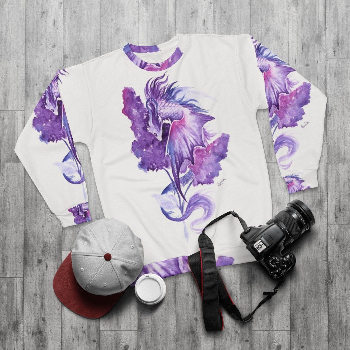 Lilac dragon sweatshirt with fantasy floral watercolor design - flat lay