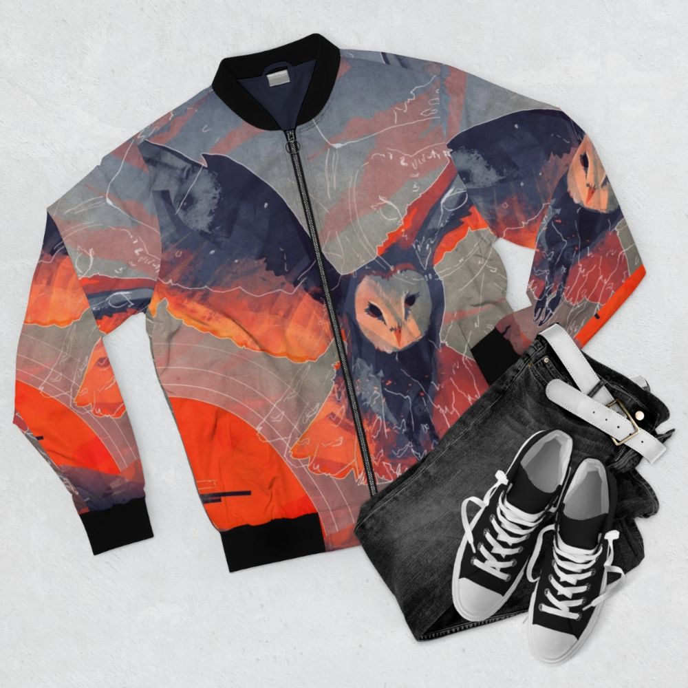 Owl Hunter Bomber Jacket featuring a sunset wildlife art design with a barn owl, talons, and mountains - Flat lay