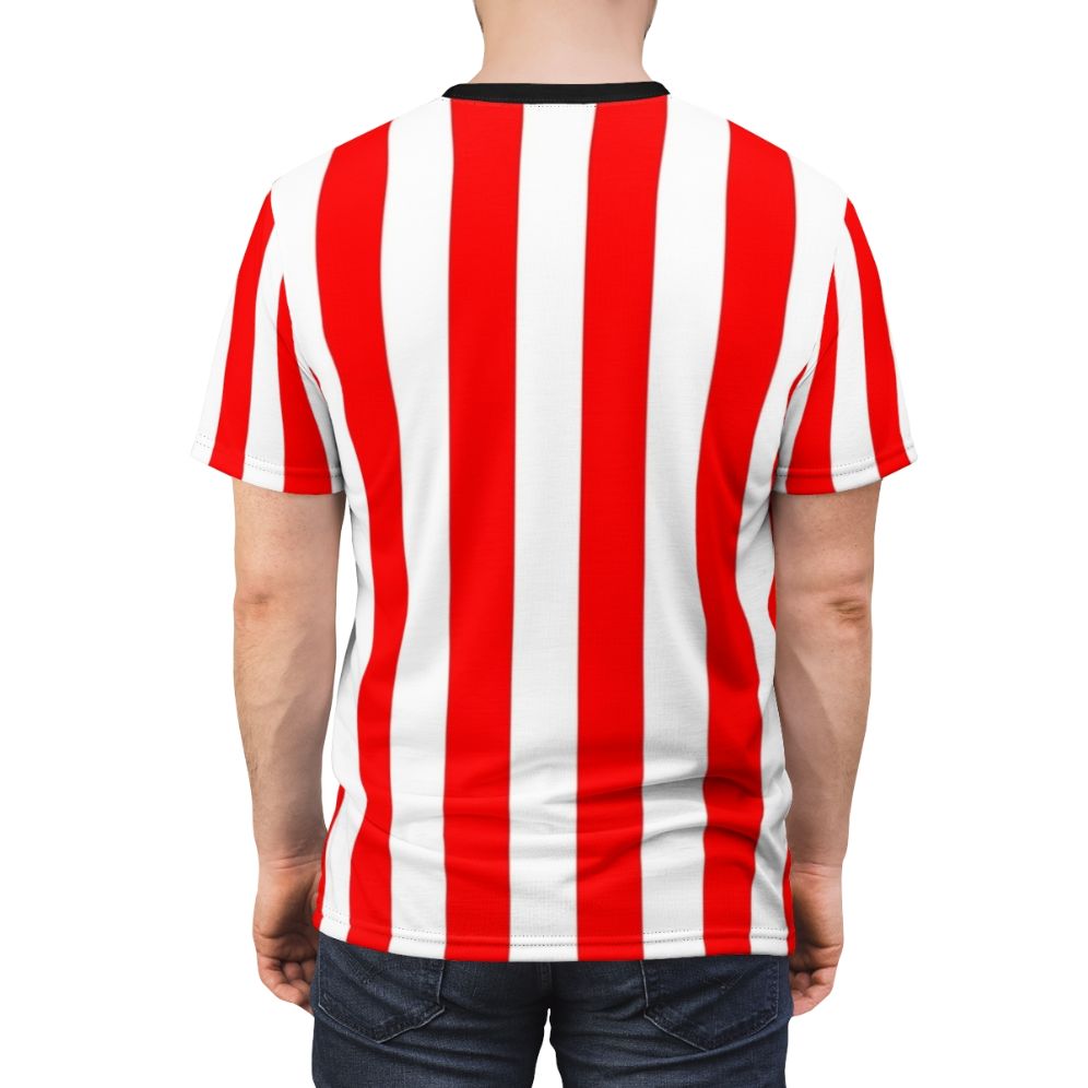 A person wearing a red and white vertical striped t-shirt with a minimalist, geometric pattern design. - men back