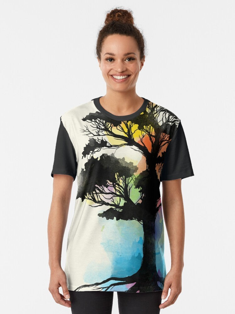 Natural Source Graphic T-Shirt featuring a watercolor-inspired nature design with trees and elements - Women