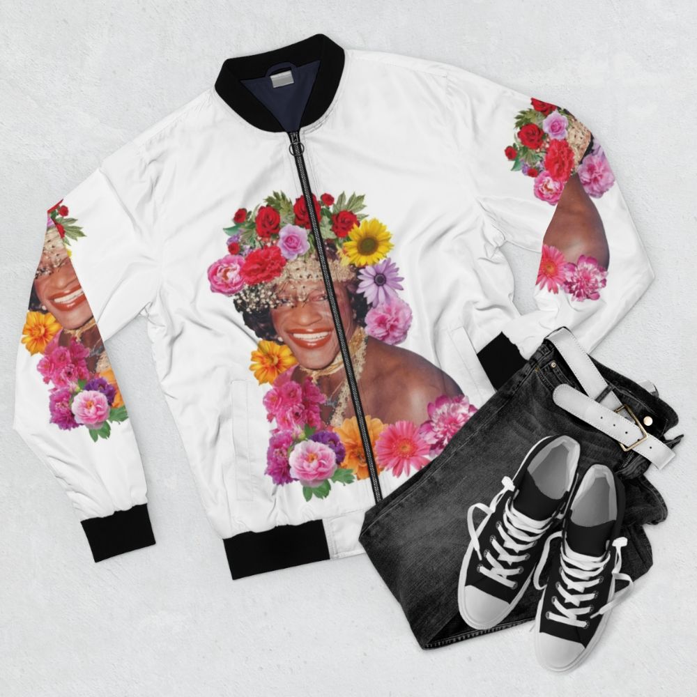 Marsha P. Johnson Floral Pride Bomber Jacket featuring a colorful floral design and "Marsha P. Johnson" text - Flat lay