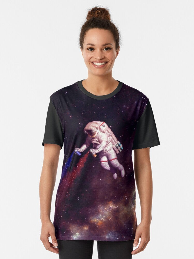 Astronaut wearing a colorful galaxy and spray paint graphic t-shirt design - Women