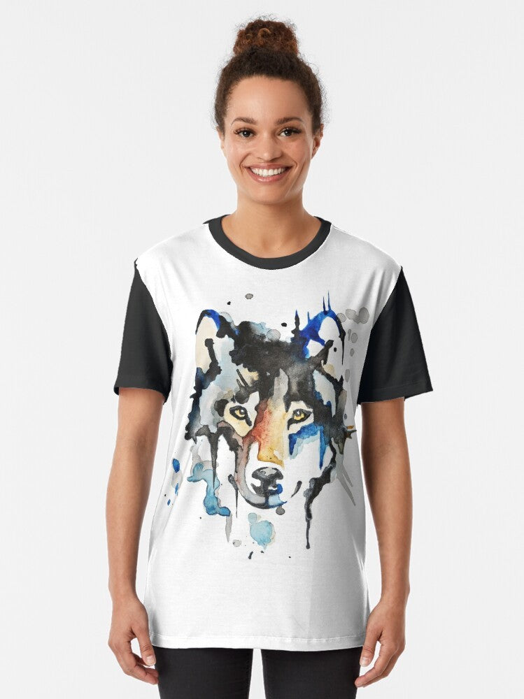 Watercolor wolf graphic design on a black t-shirt, featuring a stylized, abstract wolf illustration in shades of blue and gray. - Women