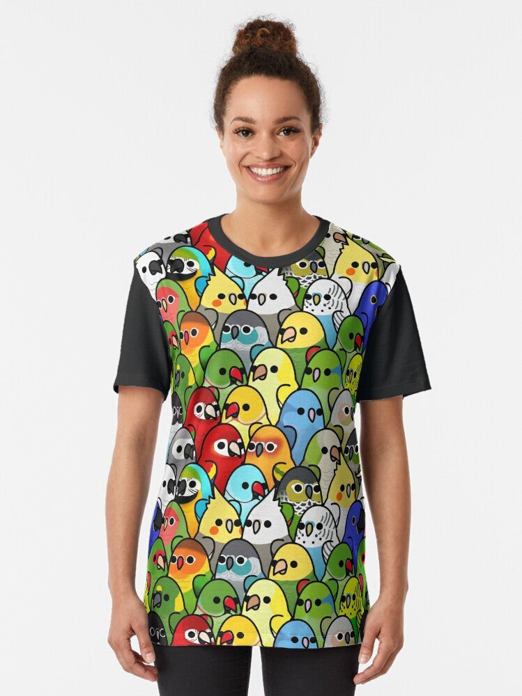 Colorful graphic t-shirt featuring a group of cute birds, including cockatiels, cockatoos, macaws, and more. The text "Too Many Birds!" is prominently displayed. - Women