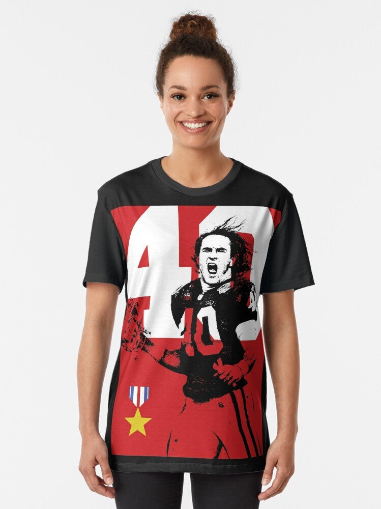 A graphic t-shirt featuring a tribute to Arizona Cardinals player and Army Ranger Pat Tillman, who was killed in action on September 11th. - Women