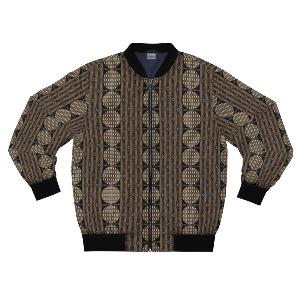 Primal patterns in gold, brown, and black bomber jacket designed by Helena Tiainen